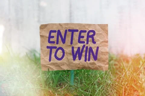 Word writing text Enter To Win. Business concept for exchanging something value Stock Photos