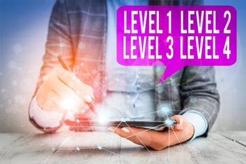Word writing text Level 1, 2, 3 and 4. Business concept for Steps levels of a Foto stock