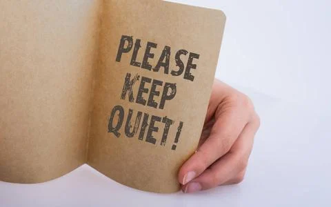 Word writing text Please Keep Quiet on paper Hand holding a Keep Quiet not... Stock Photos