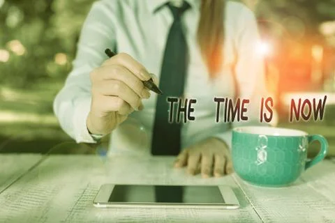 Word writing text The Time Is Now. Business concept for encouraging someone to Stock Photos