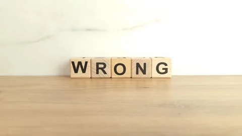 Word wrong made from wooden blocks Stock Footage 246390123