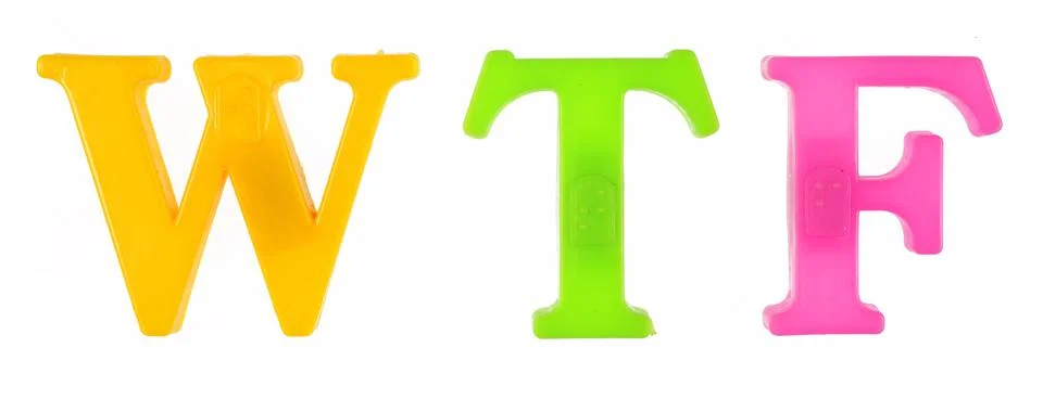 The word wtf is lined with multi-colored plastic letters Stock Photos