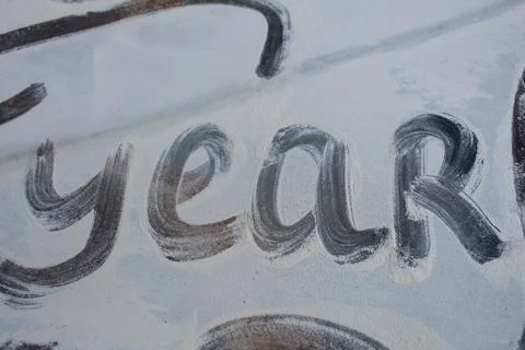 The word year on a white light background. The third word in wishing a happy new Stock Photos