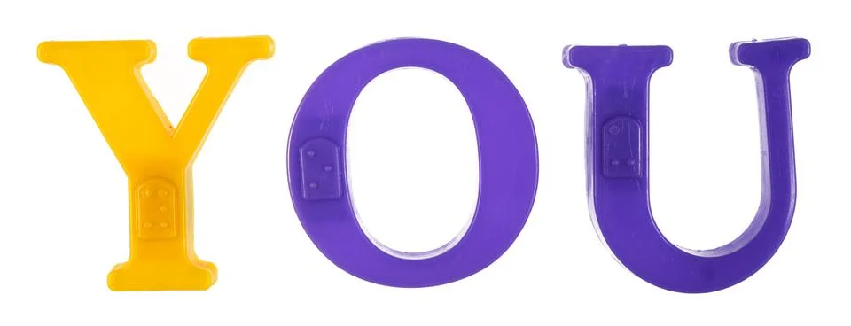 The word you is lined with multi-colored plastic letters, Stock Photos