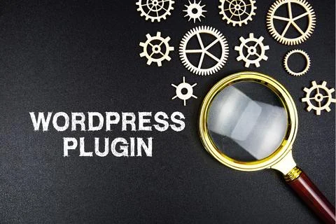 Wordpress Plugin text message with magnifying glass on black background Stock Photos