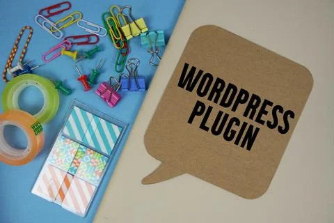 Wordpress Plugin text with stationery on cover notebook background Stock Photos