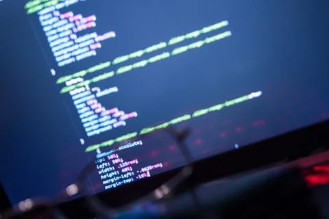 Wordpress theme code close up through sunglasses. Laptop screen with CSS code Stock Photos