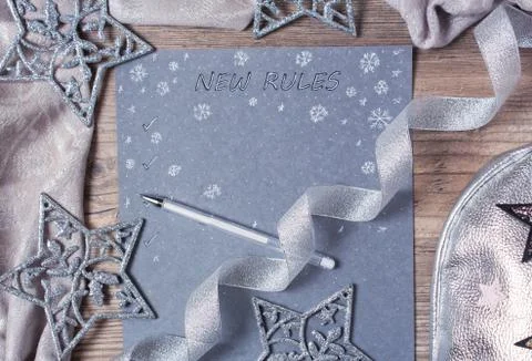 Words and patterns on gray paper. New year, new rules. Motivation, plan, sche Stock Photos