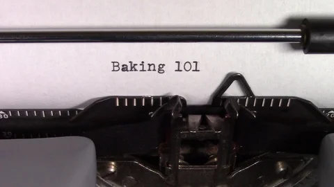 The words "Baking 101 " being typed on a typewriter Stockbeeldmateriaal 122875205