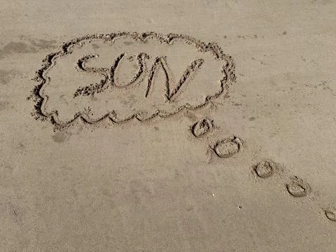 Words on the beach sun Stock Photos