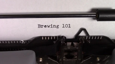 The words "Brewing 101 " being typed on a typewriter Stockbeeldmateriaal 122869565