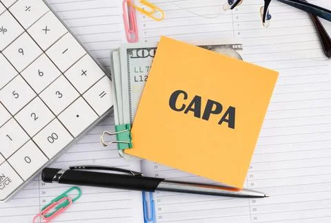 Words CAPA Corrective and Preventive action plans written on a yellow sticker Stock Photos