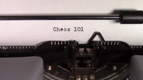 The words "Chess 101 " being typed on a typewriter Stockbeeldmateriaal 122879598