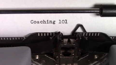 The words "Coaching 101 " being typed on a typewriter Stock Footage 122884072