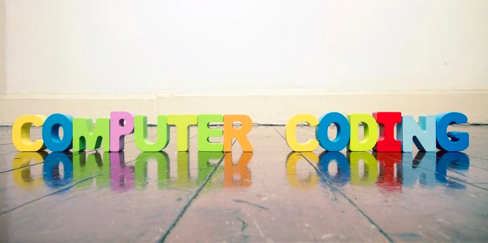 The words COMPUTER CODING  with wooden letters on an old wooden floor Stock Photos