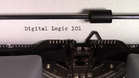 The words "Digital Logic 101 " being typed on a typewriter Stockbeeldmateriaal 122879367