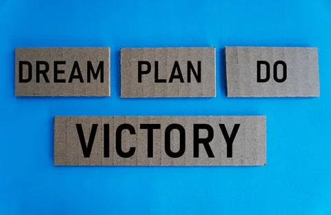 The words dream plan do victory on a paper block, self-development concept Stock Photos