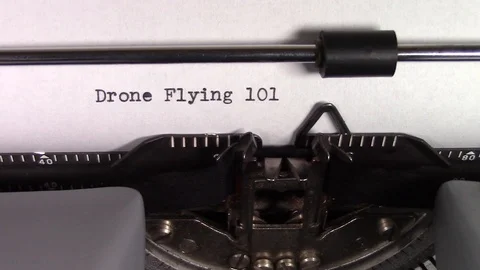 The words "Drone Flying 101" being typed on a typewriter Stockbeeldmateriaal 122881161