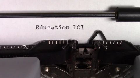 The words "Education 101" being typed on a typewriter Stock Footage 122890620