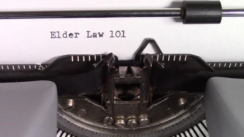 The words "Elder Law 101 " being typed on a typewriter Stockbeeldmateriaal 122887854