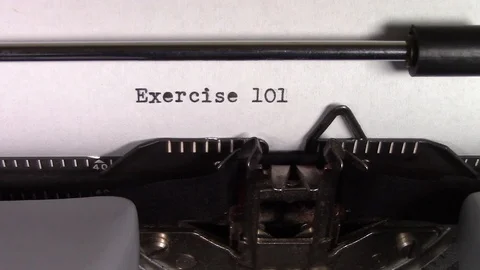 The words "Exercise 101 " being typed on a typewriter Stockbeeldmateriaal 122872989
