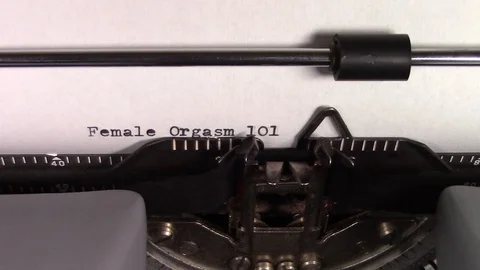 The words "Female Orgasm 101 " being typed on a typewriter Stock Footage 122879059