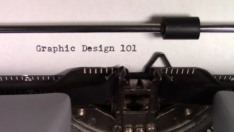The words "Graphic Design 101 " being typed on a typewriter Stockbeeldmateriaal 122879157
