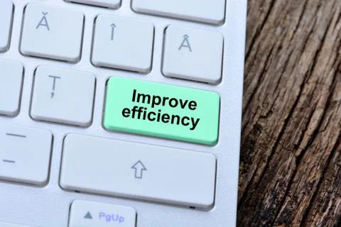 The words Improve efficiency on computer keyboard button Stock Photos