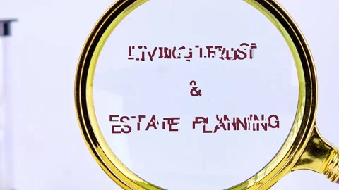 Words morph and then clarify as a magnifying glass reveals LIVING TRUST and Stock Footage 327188378