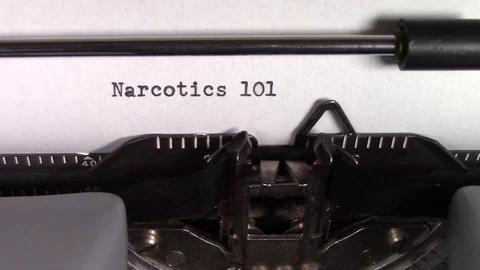 The words "Narcotics 101 " being typed on a typewriter Stockbeeldmateriaal 122886726