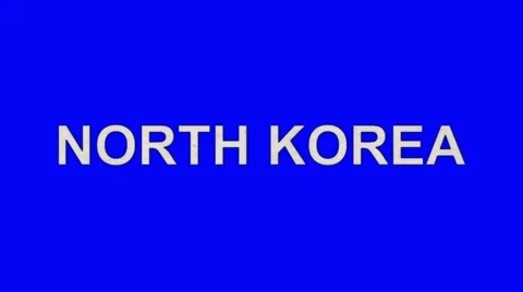 The Words North Korea Burning in Flames to Ashes on a Blue Screen Background Stock Footage 61038355