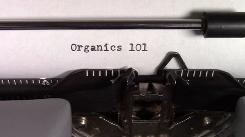 The words "Organics 101 " being typed on a typewriter Stockbeeldmateriaal 122871753