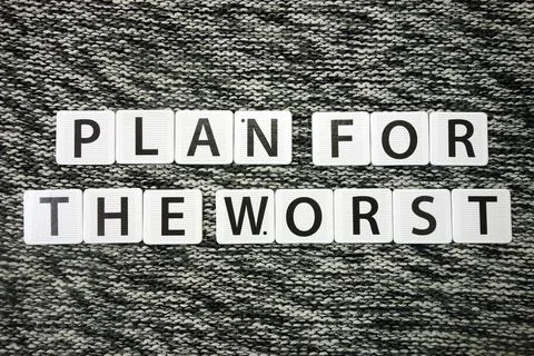 Words plan for the worst on dark background. Risk management strategy and pla Stock Photos