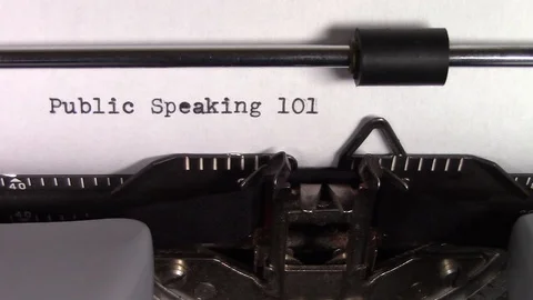 The words "Public Speaking 101 " being typed on a typewriter Stockbeeldmateriaal 122875606