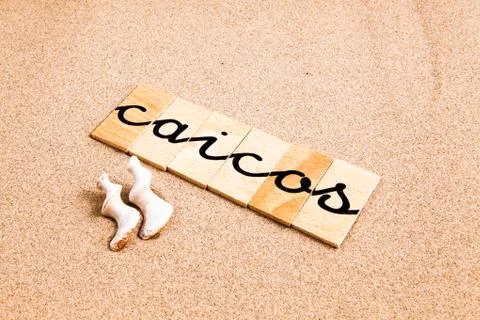 Words on sand Caicos Stock Photos