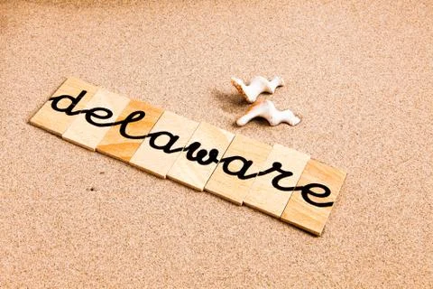 Words on sand Delaware Stock Photos