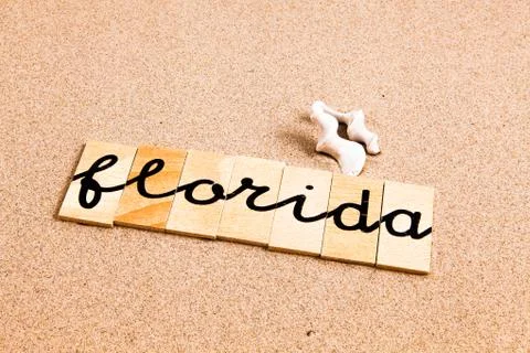Words on sand Florida Stock Photos