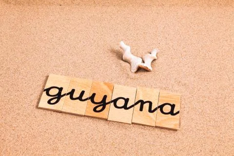 Words on sand Guyana Stock Photos