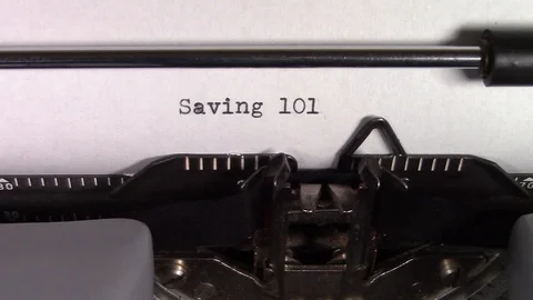 The words "Saving 101 " being typed on a typewriter Stockbeeldmateriaal 122875881