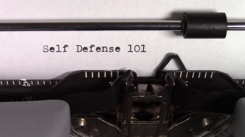 The words "Self Defense 101 " being typed on a typewriter Stockbeeldmateriaal 122875585