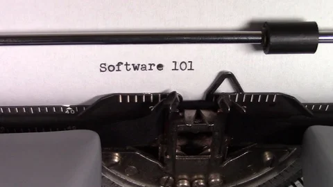The words "Software 101 " being typed on a typewriter Stockbeeldmateriaal 122878938