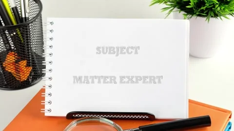 The words SUBJECT MATTER EXPERT gracefully appear on a pristine white notepad, Stock Footage 327443585