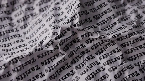 Words Tariffs print on paper for trading business background. Stock Footage 306779676