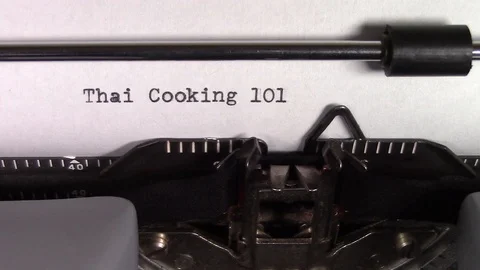 The words "Thai Cooking 101 " being typed on a typewriter 스톡 동영상 122877853