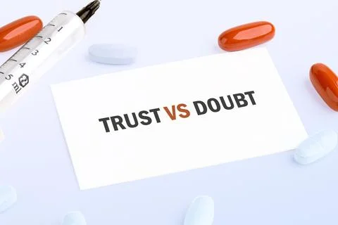 The words TRUST VS DOUBT appear on a white card, set against a backdrop of .. Stock Photos