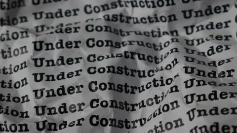 Words Under Construction Seamless print on crumpled paper for business back.. Stock Footage 312495579