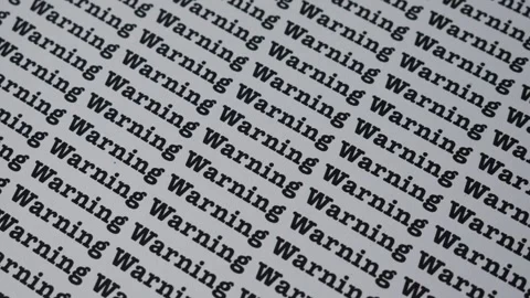 Words Warning Seamless print on paper. Stock Footage 312320960