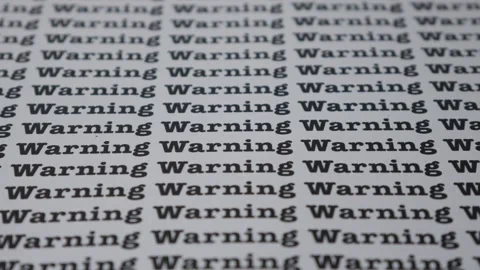 Words Warning Seamless print on paper for business background. Stock Footage 312495572