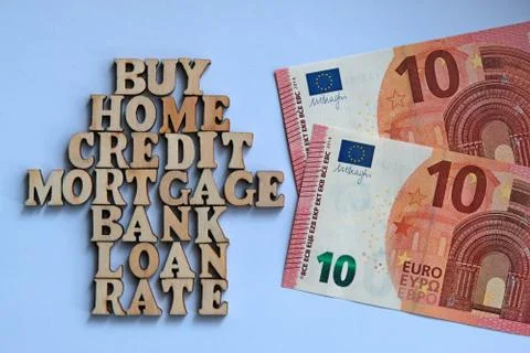 Words on a white background lined in the form of a house of wooden letters ne Stock Photos