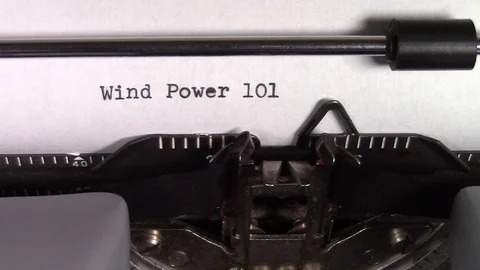 The words "Wind Power 101 " being typed on a typewriter Stockbeeldmateriaal 122884085